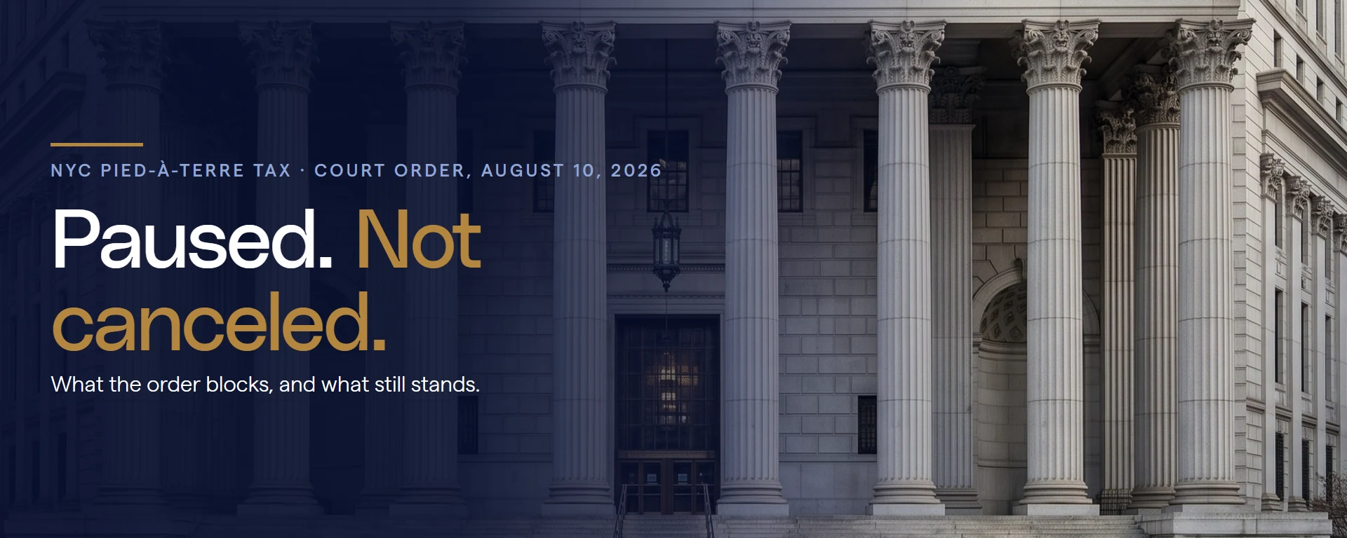 Paused. Not canceled. Court order update on the NYC pied-a-terre tax, August 10, 2026, over a courthouse colonnade.